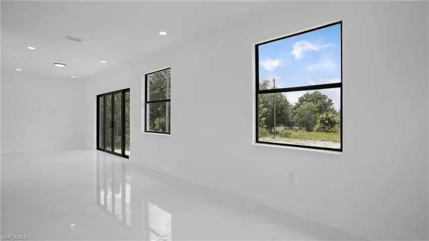 Empty room featuring recessed lighting