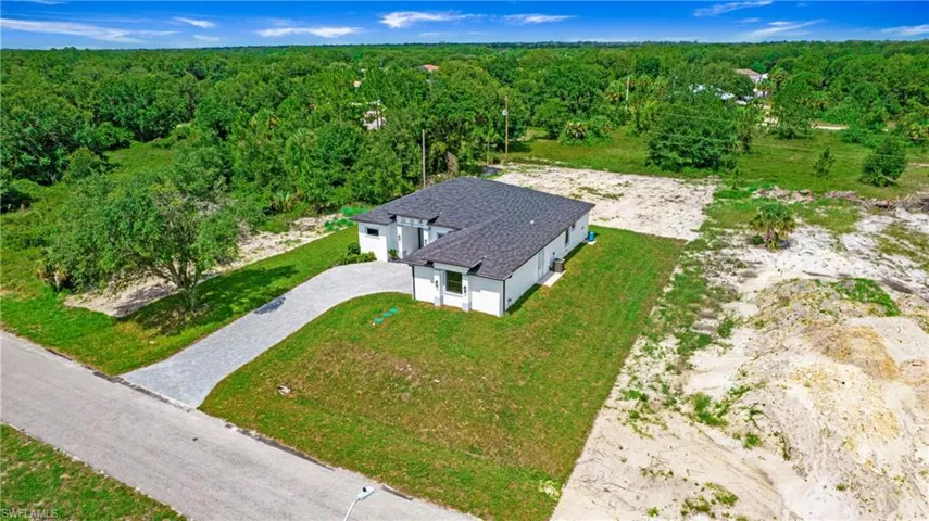 View from above of property with a heavily wooded area