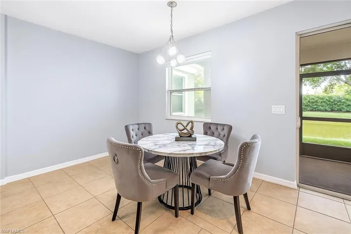 Dining room featuring baseboards and light tile patterned flooring