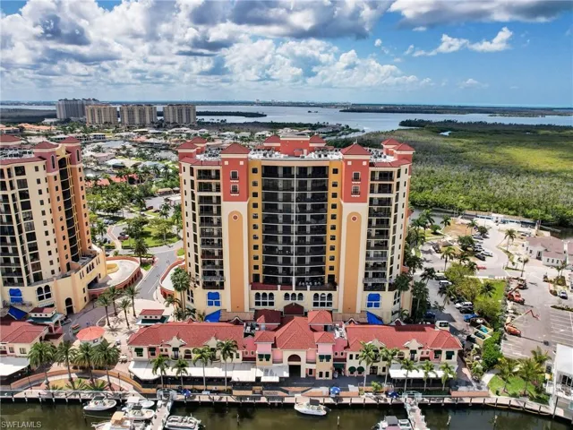 Birds eye view of property featuring a water view