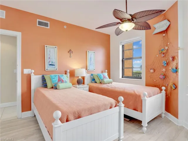 Bedroom featuring ceiling fan and light hardwood / wood-style flooring