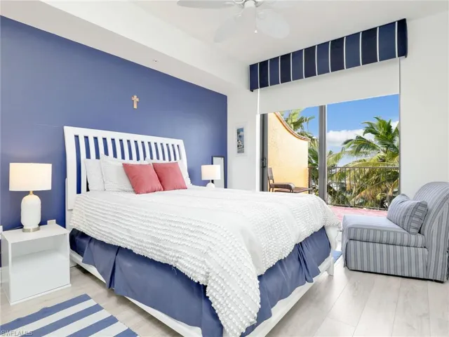 Bedroom with ceiling fan and light hardwood / wood-style flooring