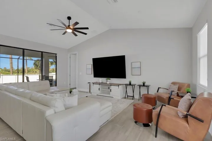 Vaulted ceiling with a contemporary ceiling fan and light fixture