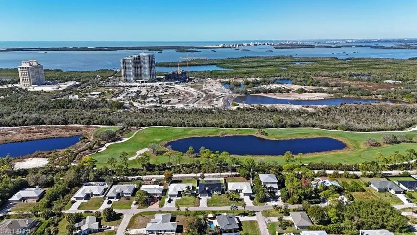 Coastal water, golf course, and surrounding natural landscape