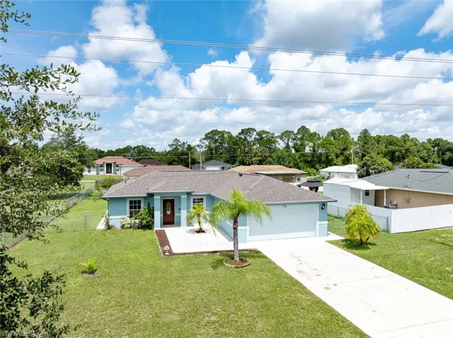 Single story home with a front yard