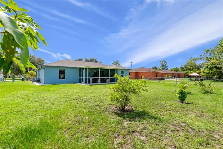 View of yard featuring a sunroom