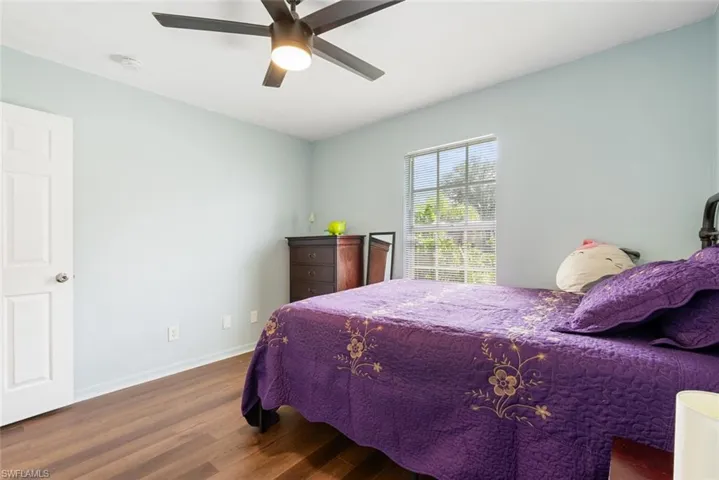 Bedroom featuring ceiling fan and hardwood / wood-style floors