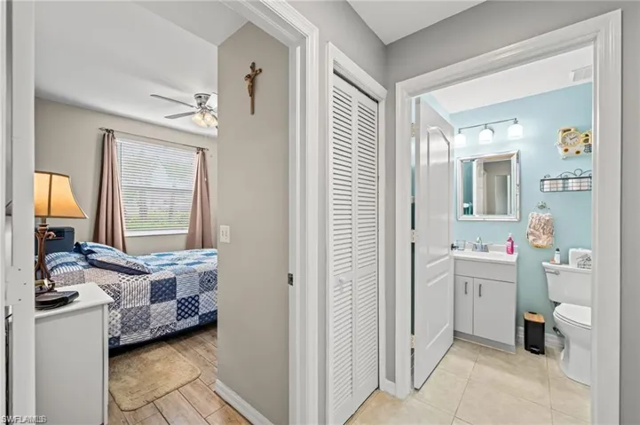 Bathroom featuring vanity, toilet, and walk in shower