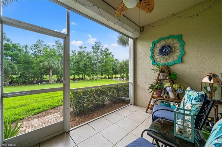 Sunroom featuring ceiling fan and a healthy amount of sunlight