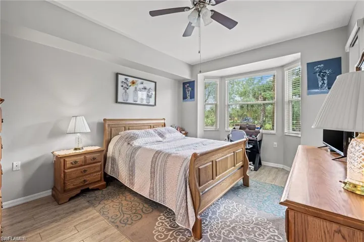 Bedroom featuring ceiling fan and light wood-type flooring