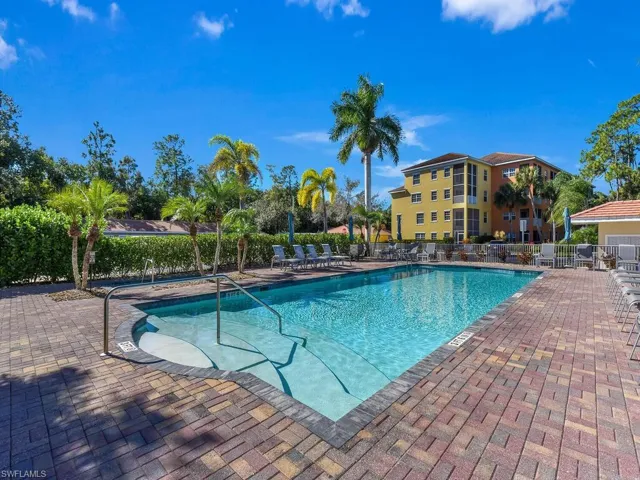Community pool with a patio area