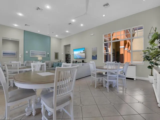 Dining room with recessed lighting, light tile patterned floors, and a ceiling fan