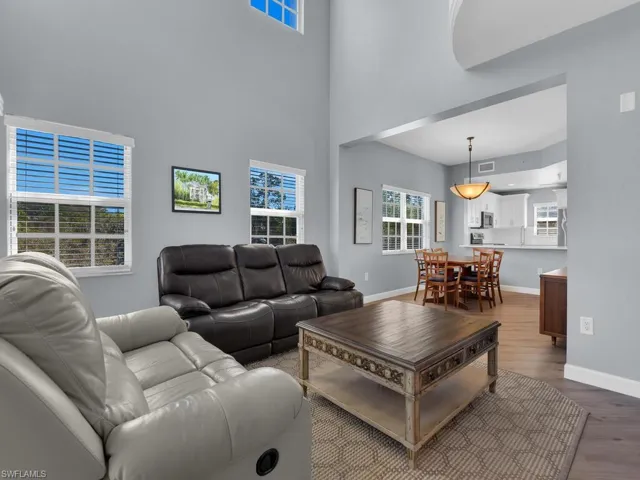 Living area with wood finished floors and baseboards