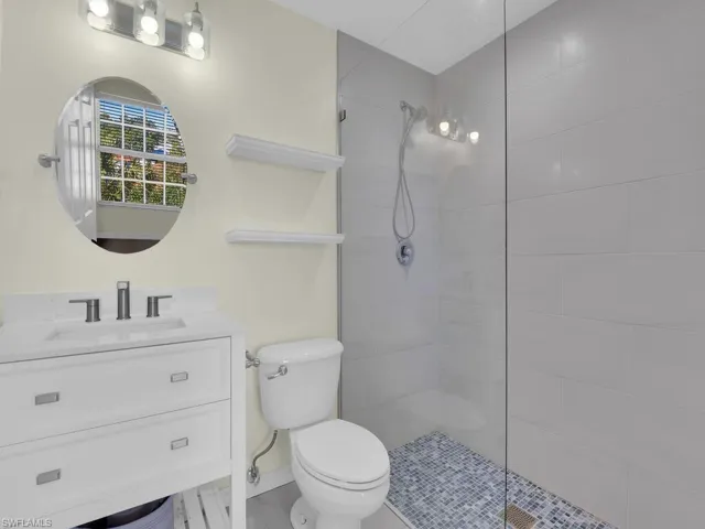 Bathroom featuring vanity and a walk in shower