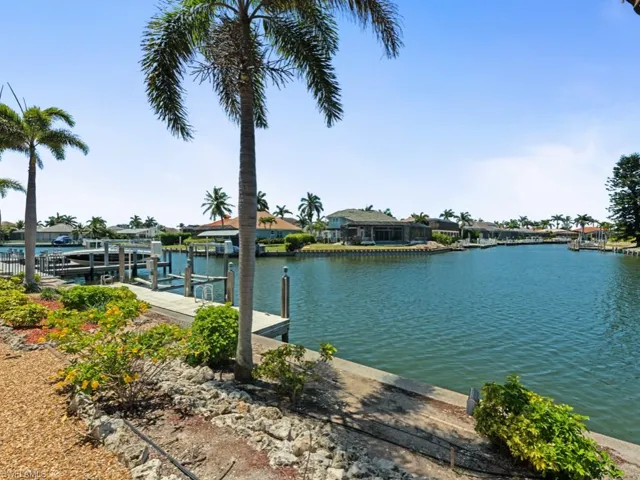 Dock area with a water view and boat lift