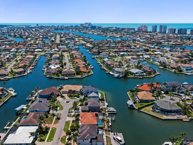 Aerial view with a water view, a view of city, and a residential view