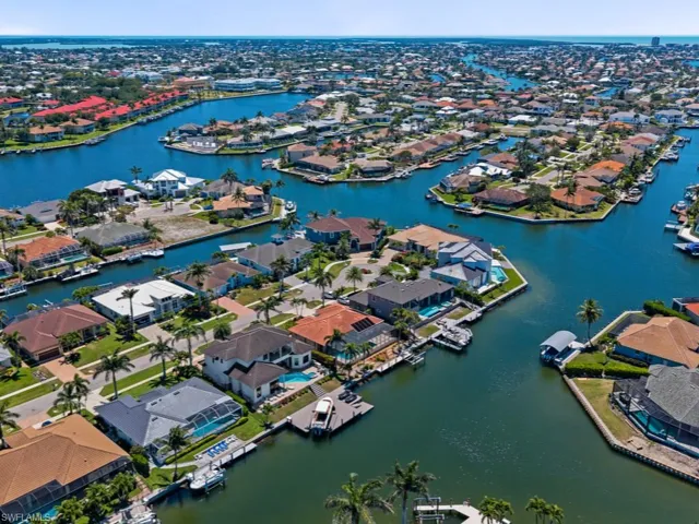 Aerial view featuring a water view and a residential view
