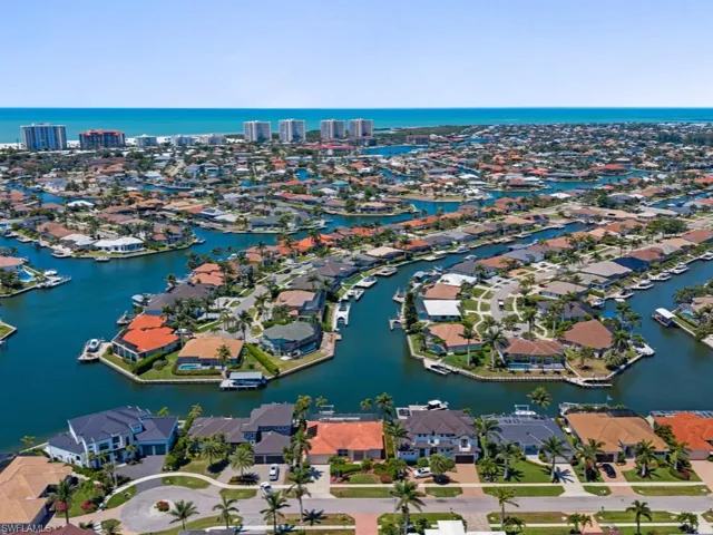 Aerial view featuring a water view and a residential view