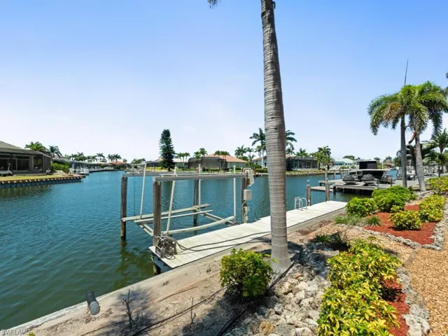 View of dock featuring a water view and boat lift