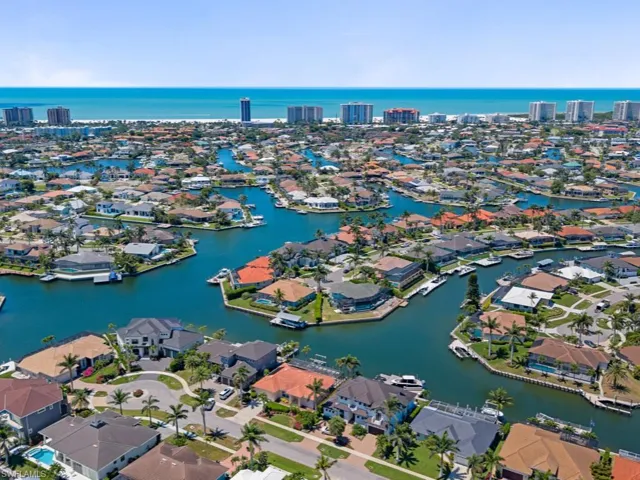 Aerial view featuring a water view and a residential view