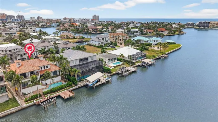 Aerial view of residential area with a nearby body of water