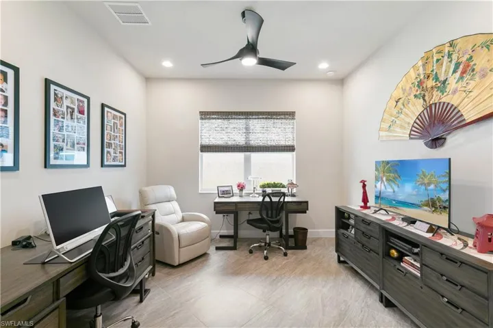 Home office featuring ceiling fan, recessed lighting, and baseboards