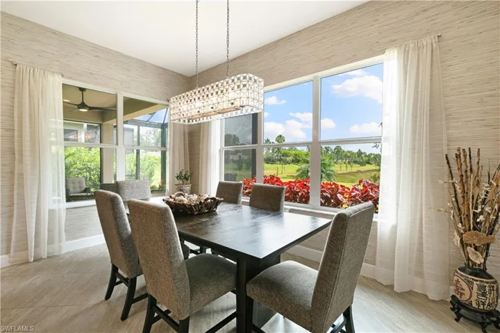 Dining space with healthy amount of natural light and a ceiling fan