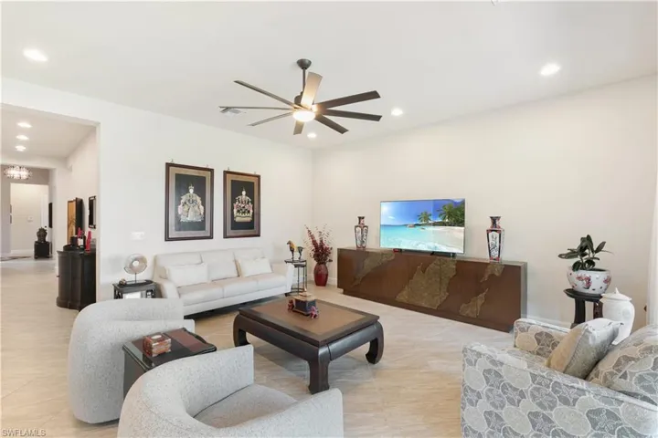 Living room featuring recessed lighting and ceiling fan