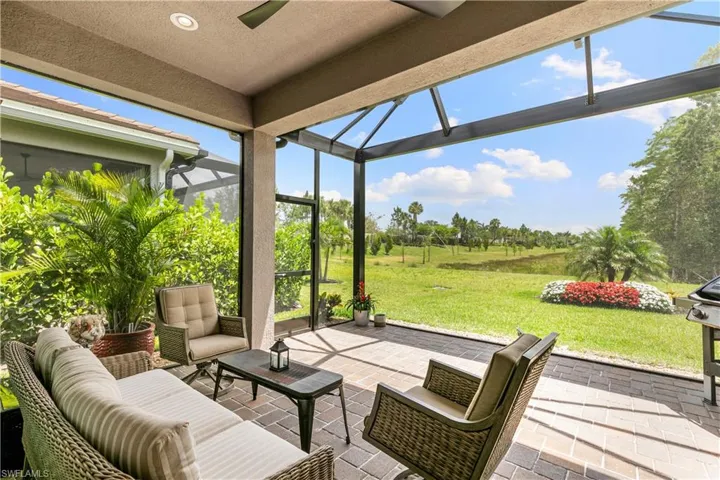 View of patio featuring outdoor lounge area and a lanai
