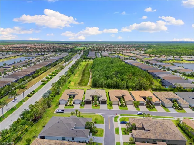Aerial view of residential area featuring a large body of water