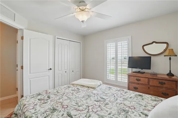 Bedroom featuring a closet and ceiling fan