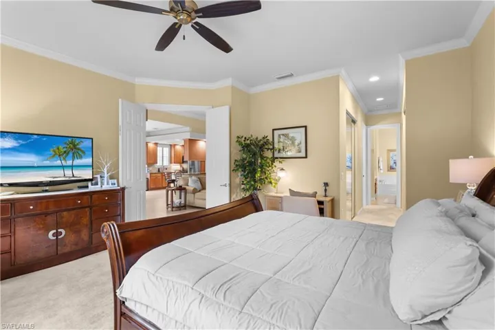 Room featuring crown molding, neutral wall tones, recessed lighting, and a ceiling fan
