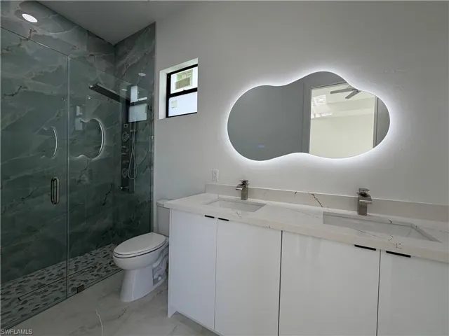 Dual vanity with undermount sinks and light-toned countertops