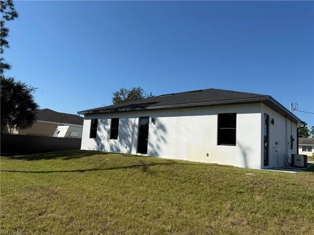 Back of property with stucco siding