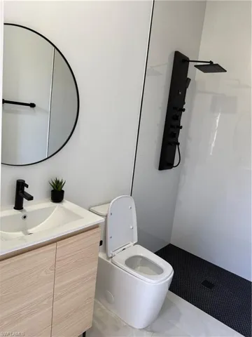 Bathroom with vanity and a walk in shower