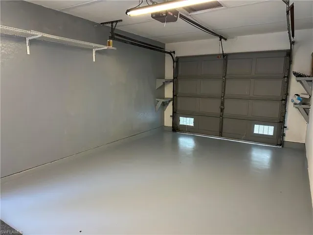 Garage featuring a garage door opener