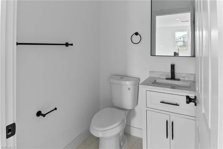 Bathroom with toilet and vanity
