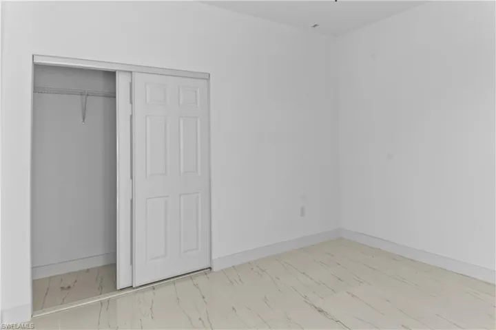 Unfurnished bedroom featuring a closet