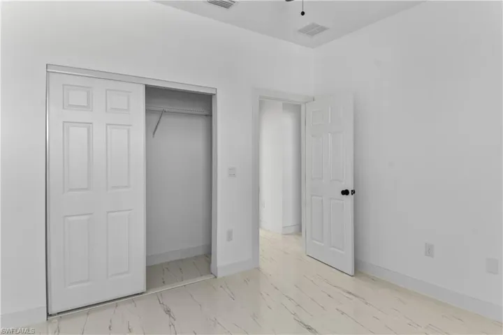 Unfurnished bedroom with a closet