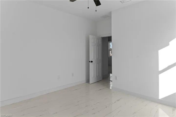 Empty room featuring ceiling fan