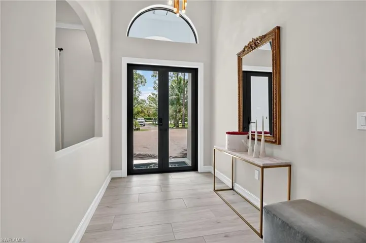 Foyer with a high ceiling and french doors