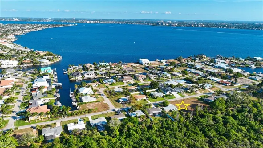 Aerial view of residential area with a large body of water