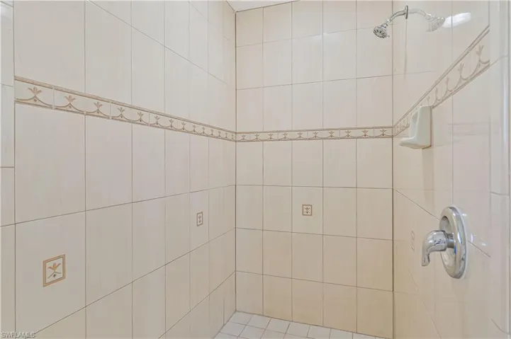 Bathroom with a tile shower