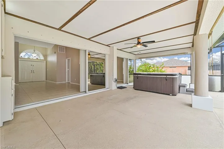 View of patio / terrace with a hot tub and ceiling fan