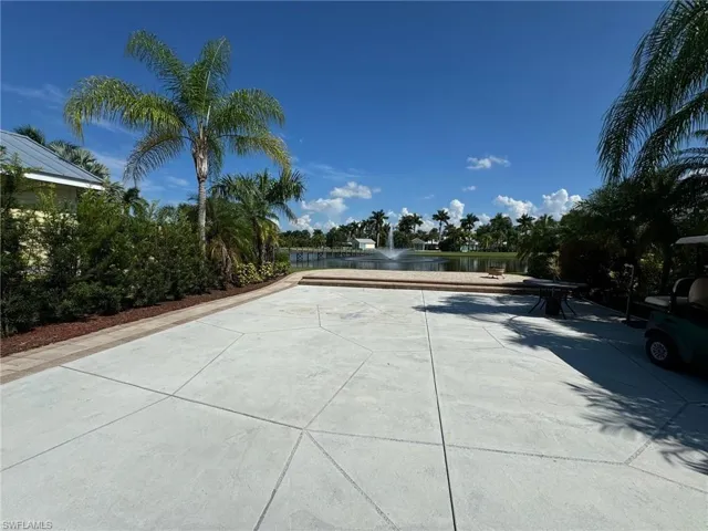 View of pool with a water view