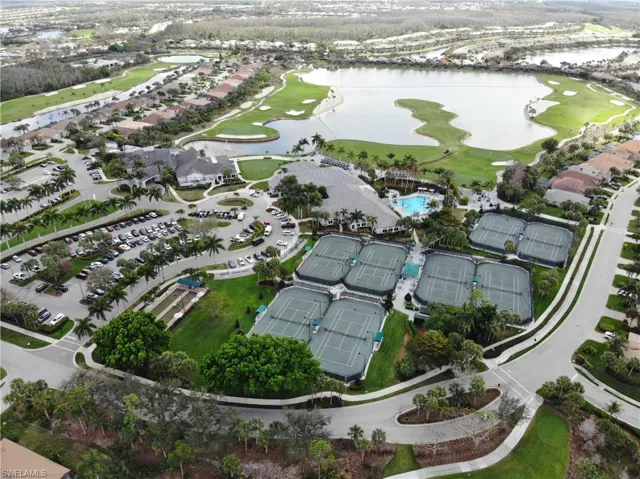 Bird's eye view of a golf course and a nearby body of water
