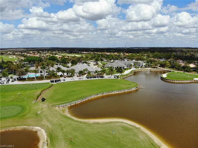 Aerial view of a local golf course and a nearby body of water