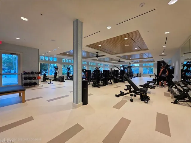 Exercise room featuring recessed lighting