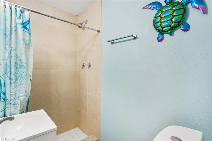 14937-Bathroom with sink, walk in shower, and toilet
