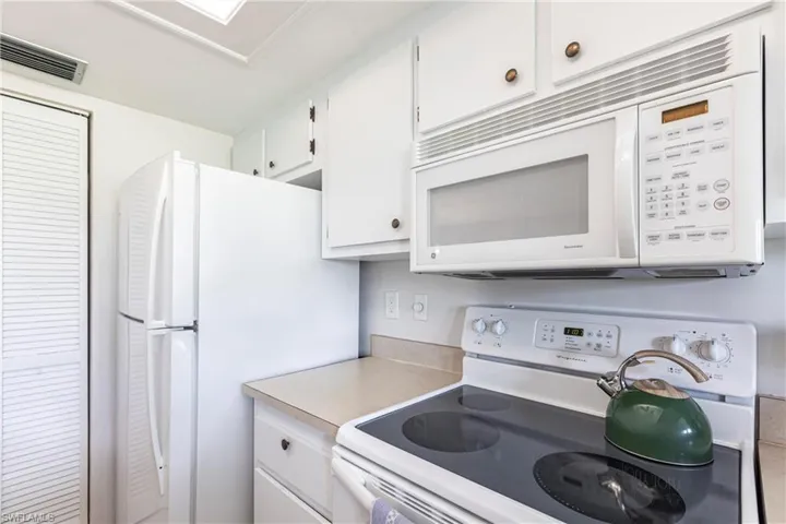 Kitchen with newer white appliances